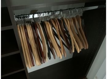 LARGE LOT OF WOOD AND PLASTIC HANGERS