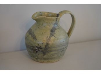 CLAY PITCHER WITH HANDLE AND SIGNED 7IN HIGH