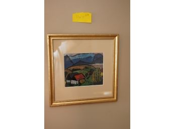 PRINT OF A VILLAGE SIGNED ON A GOLD WOOD FRAME 11X11 INCHES