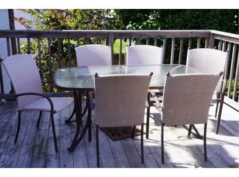 OUTDOOR GLASS TOP TABLE WITH 6 WICKER STYLE CHAIRS