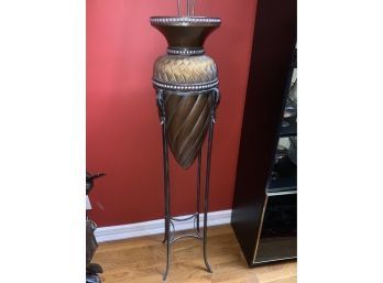 ELEGANT TALL VASE ON A METAL STAND SIGNED AT THE BOTTOM, 56IN HIGH