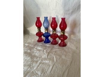 LOT OF 4 SMALL GLASS OIL LAMPS