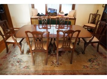 MAHOGANY WOOD TABLE WITH BRASS FEET AND 6 REGULAR CHAIRS AND 2 ARM CHAIRS