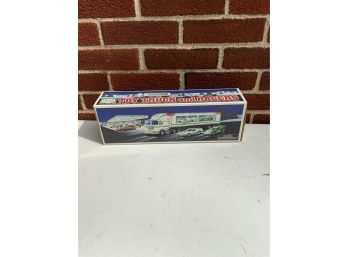 NEW HESS TOY TRUCK AND RACERS