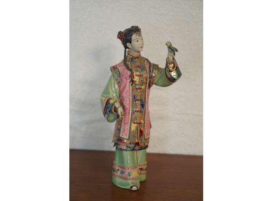 ASIAN STYLE FIGURINE OF A WOMEN WITH A BIRD, 8IN HEIGHT