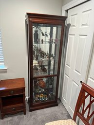 Collectors Cabinet By Howard Miller