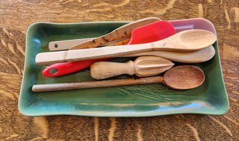 Assortment Of Kitchen Cooking Utensils With Ceramic Serving Plate