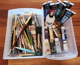 Assortment Of Art Supplies And Brushes