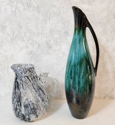 (2) Decorative Pitcher Vessels - (1) Glass And (1) Ceramic