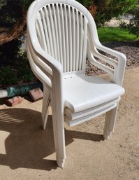 (4) White Plastic Patio Chairs