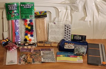 Assortment Of Craft Supplies And Clear Storage Tote