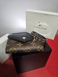 Luis Vuitton Or A Good Copy Monogram Bracelet And Vallet, With Box