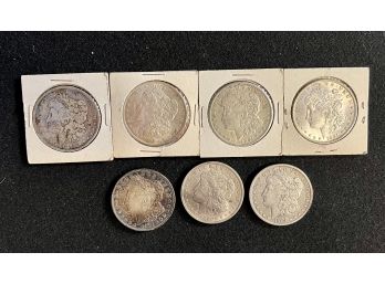 Group Of Seven U.s. Silver Morgan Dollars, Fine To Brilliant Uncirculated Condition, Various Dates