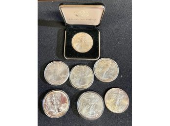 Group Of Seven Uncirculated Various Date Silver American Eagles
