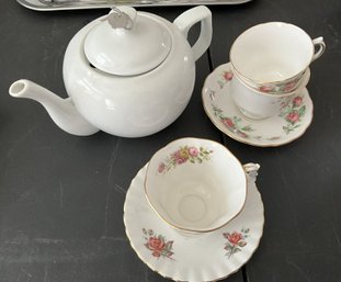 Teapot With Tea Cups And Saucers