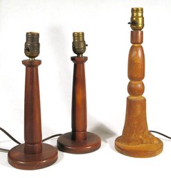 THREE ANTIQUE HANDMADE WOODEN TABLE LAMPS, INCLUDING A PAIR, EARLY 20TH CENTURY