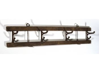 PRIMITIVE ANTIQUE WALL RACK WITH FOUR FOLDING IRON HOOKS