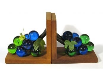 VINTAGE PAIR OF WOODEN BOOKENDS FEATURING OVERSIZED ACRYLIC GRAPES, MID 20TH CENTURY