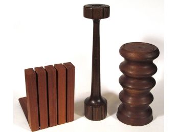 THREE MID-CENTURY WOODEN DECORATIVE OBJECTS, INCLUDING A RAYMOR CANDLESTICK AND KALMAR BOOKEND
