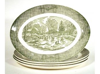 FOUR SCIO POTTERY OVAL PLATTERS OR PLATES IN THE GREEN CURRIER & IVES PATTERN, 1960s