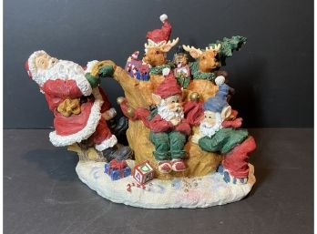 Santa With Elves And Reindeer Statue