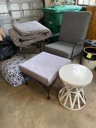 Lot 323 Wrought Iron Chair, Ottoman, Cushions, And Table