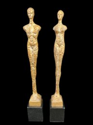 Pair Of Tall Metal Sculptures On Marble Bases
