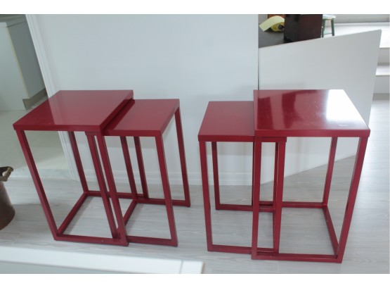 Two Sets Of Red Stacking Tables