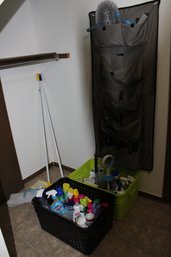 Tall Wire Storage Rack With Blankets And Sheets And Cleaning Products
