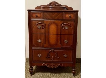 Antique Gentleman's Chest On Casters With Brass Pulls And Carved Wood Front