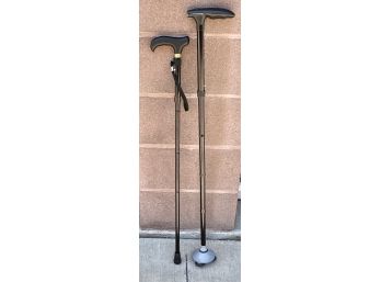 (2) Walking Canes One Collapsible And One Adjustable With Flashlight On End
