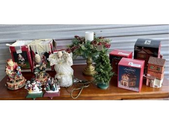 Collection Of Christmas Decor Including Resin Santa's, Metal Stocking Holders, Light Up Houses, And More
