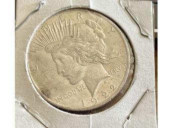 1922 Peace Silver Dollar In Plastic Sleeve