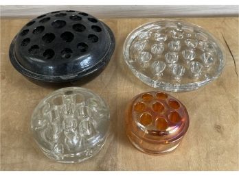 (4) Assorted Flower Frogs Black Glass, Carnival Glass And Clear