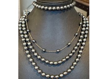 Two Gray Faux Pearl Necklaces, (1) With Gold Tone Chain And (1) Stretch Bracelet