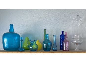 Assorted Collection Of Colorful Glassware Including Cased Glass Vases, Bottles, And More