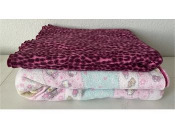 (2) Fleece Blankets Including A Hello Kitty And Purple Leopard Print