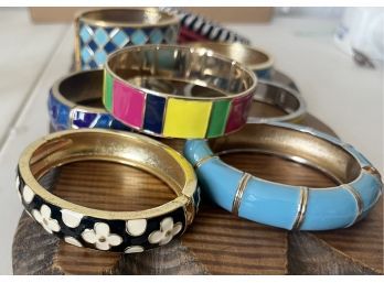 Lot Of Assorted Color Material, Enamel, And Gold Tone Bangle Bracelets