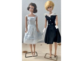 Two Early 1962 Midge Barbie Dolls On Stands