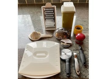 Collection Of Kitchen Gadgets Including Pizza Cutter, Strainer, Cheese Grater, Vintage Tupperware, And More