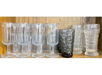 Collection Of Mid Century Modern Glassware - Light Blue Glasses, Ribbed Glasses, And Black Glasses.
