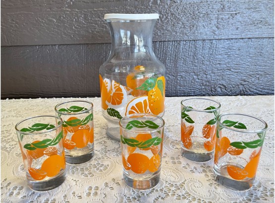 Anchor Hocking Orange Carafe With 5 Glasses And Plastic Lid