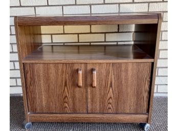 Small Wood & Veneer Media Cabinet On Plastic Casters With Bottom Storage