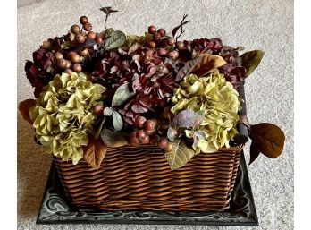 16 Inch Handled Wicker Basket With Faux Flowers And Metal Plant Base