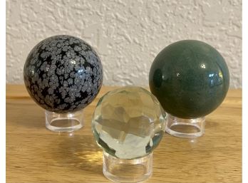 (3) Stone And Glass Spheres With Stands - Jadeite, Snow Flake Obsidian And Crystal