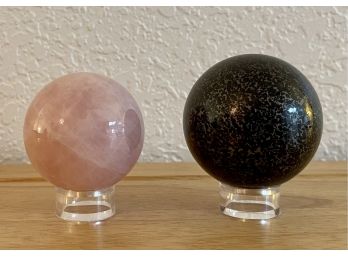 (2) Stone Spheres With Plastic Stands - Black Obsidian And Pink Quartz