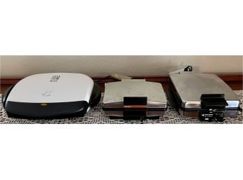 (3) Assorted Griddles - Rival Pizzelle Maker, George Forman, And Black And Decker Waffle Baker