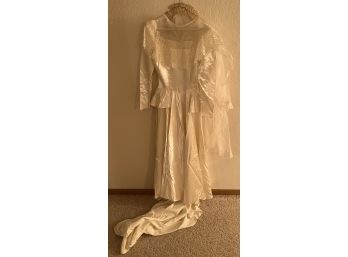 Antique Egg Shell Satin Wedding Dress With Lace Trim And Net Vail