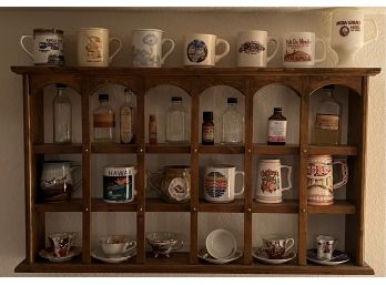 Vintage Wooden Wall Shelf With Assorted Bottles, Mugs, Cups, And Saucers