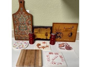 Collection Of Wood And Ceramic Cutting Boards, Trivets, Salt And Pepper, And More